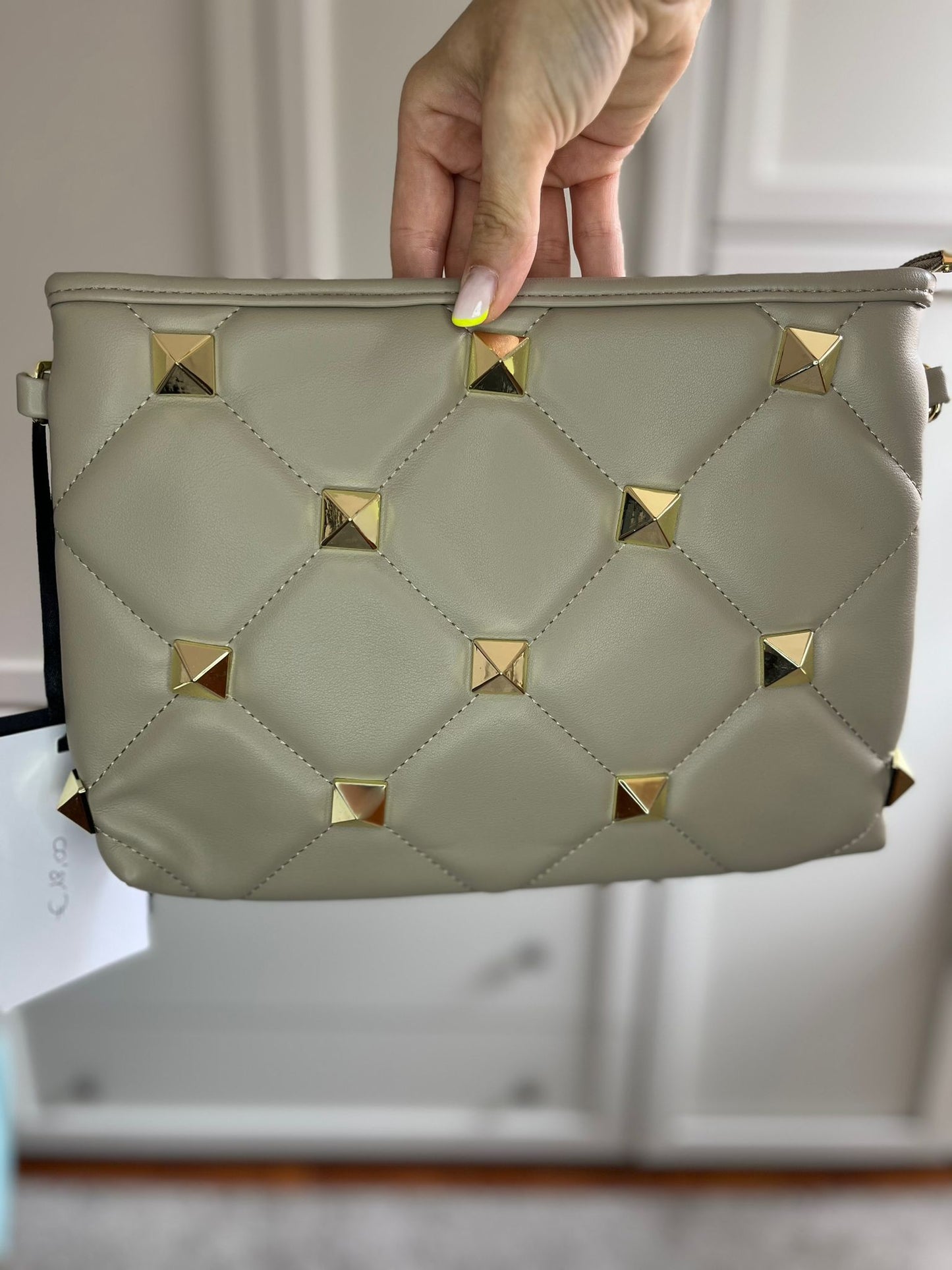 Pochette borchie beige